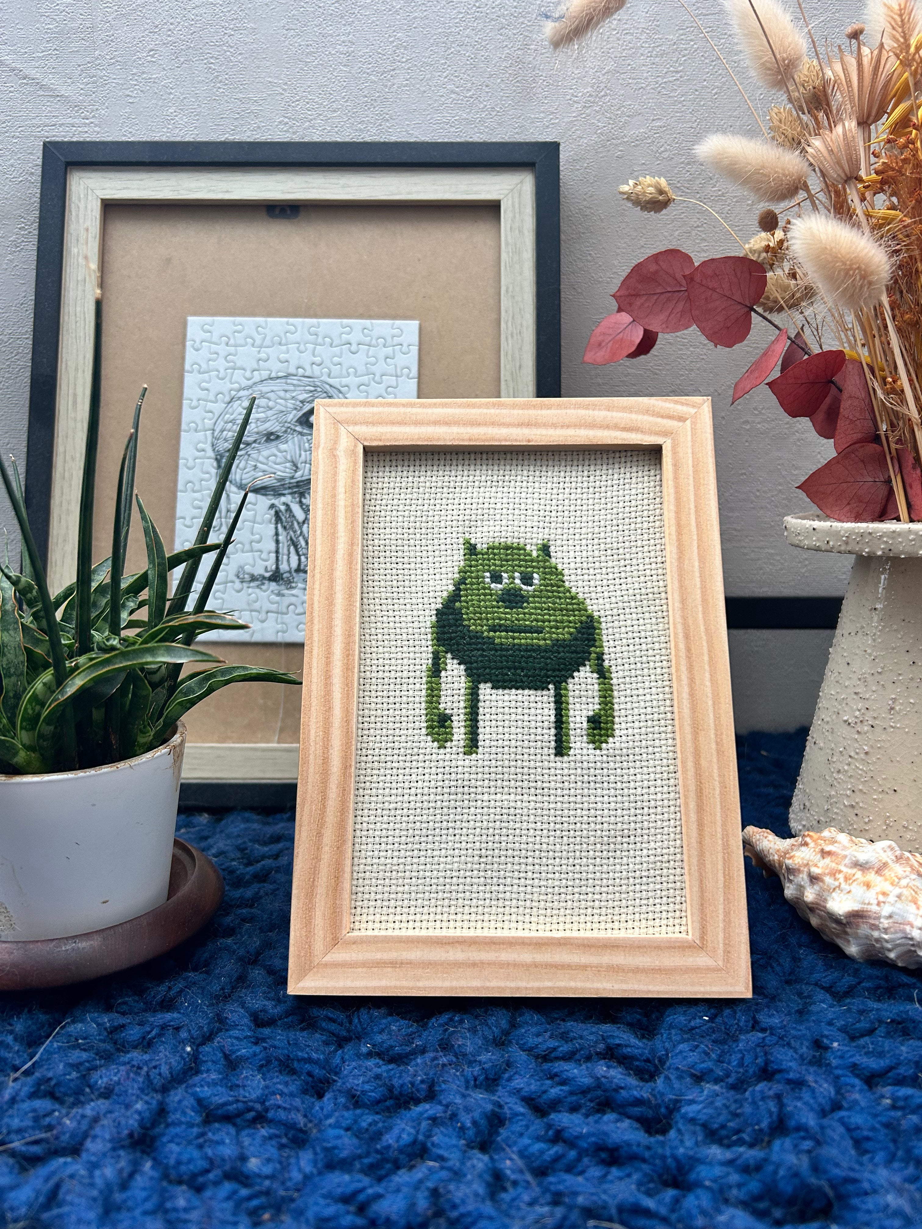 Cadre en bois brodé au point de croix