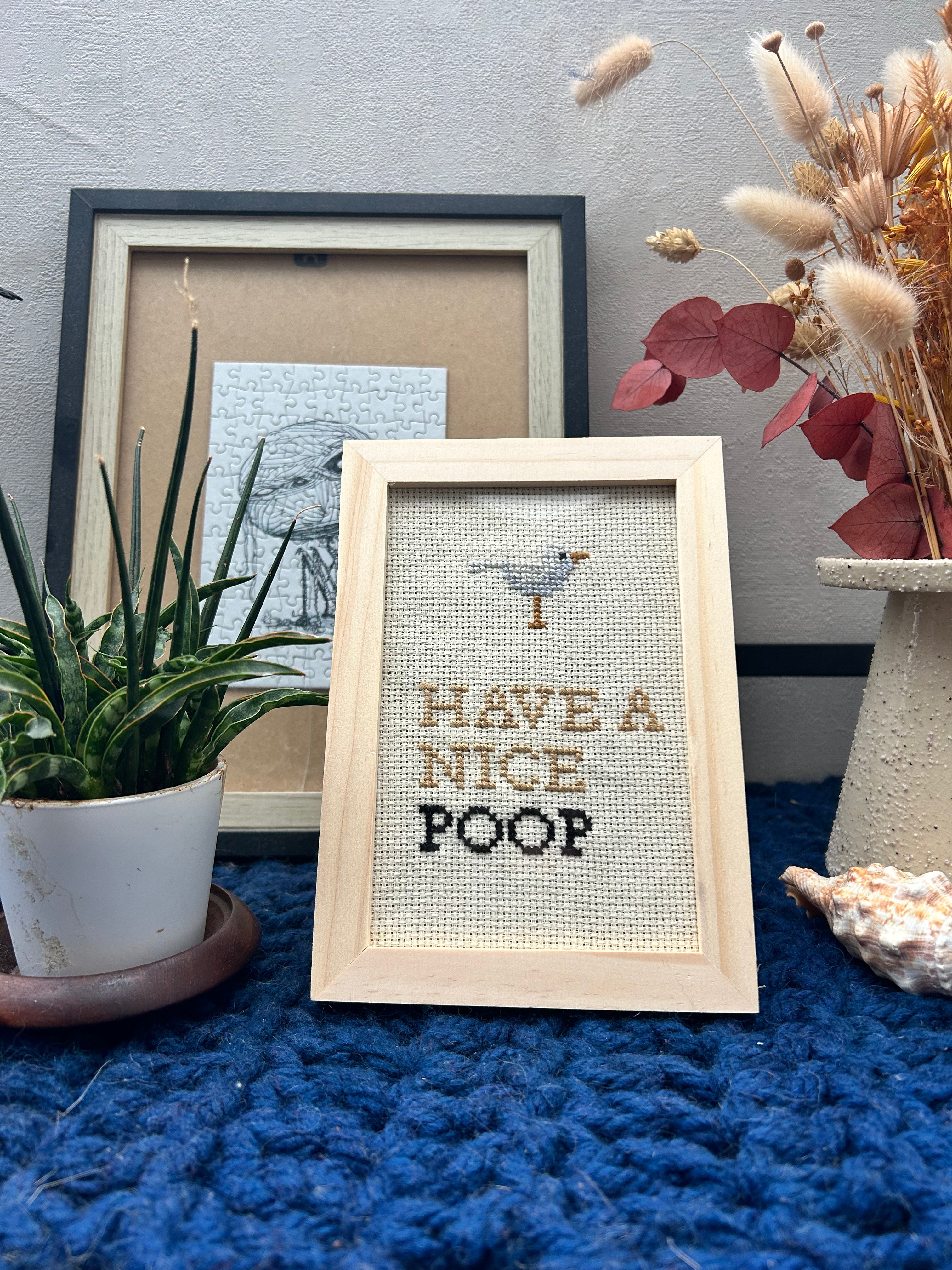 Cadre en bois brodé au point de croix