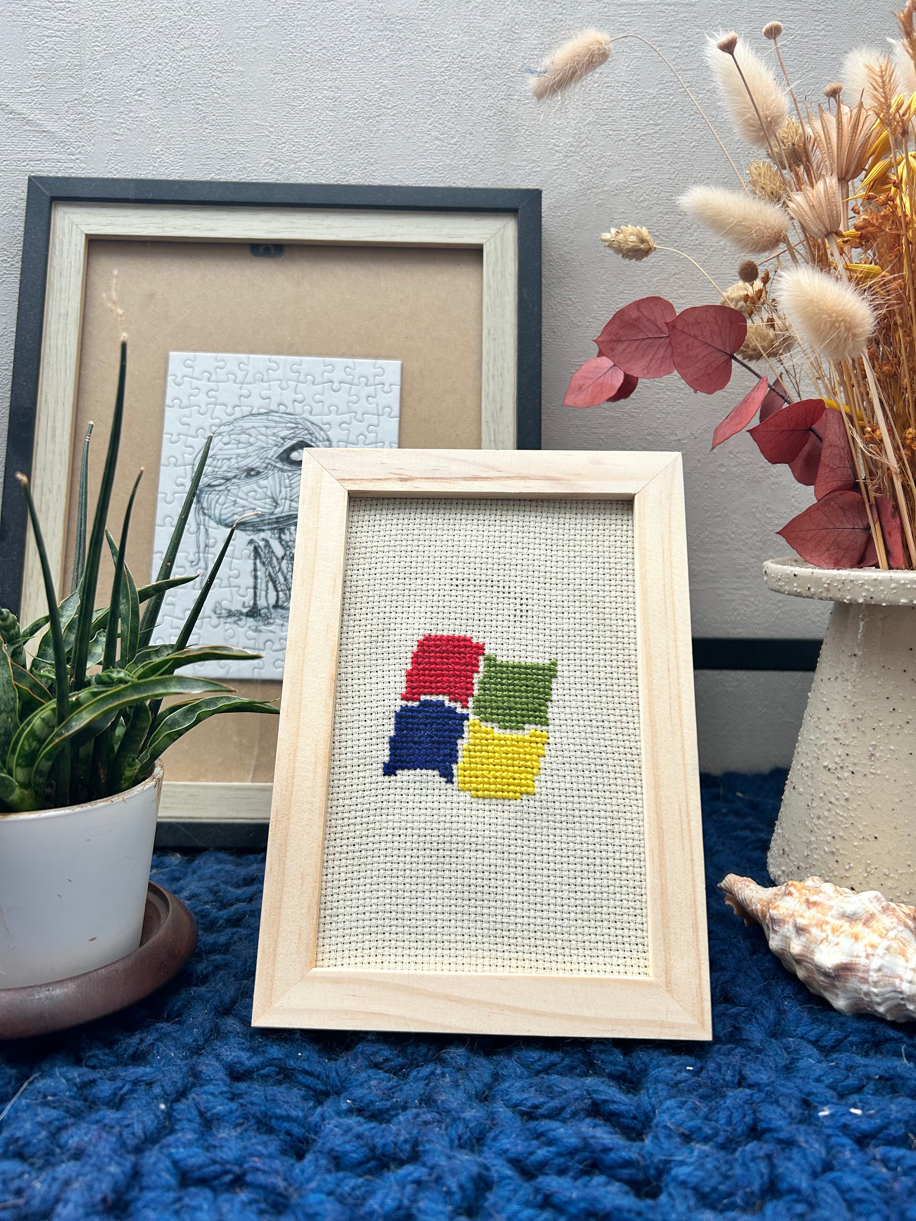 Cadre en bois brodé au point de croix